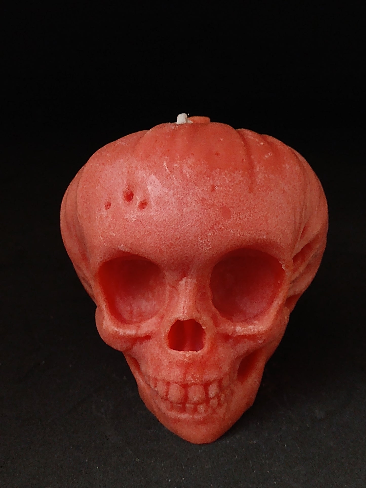 pumpkin skull candle